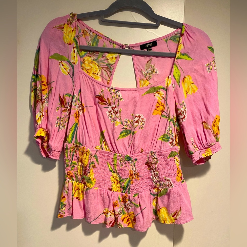 Pink floral peplum top
